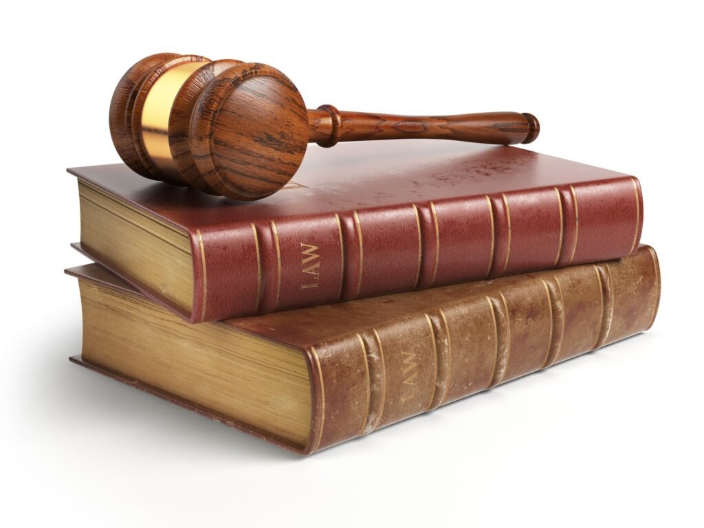 Gavel and lawyer books isolated on white. Justice, law and legal